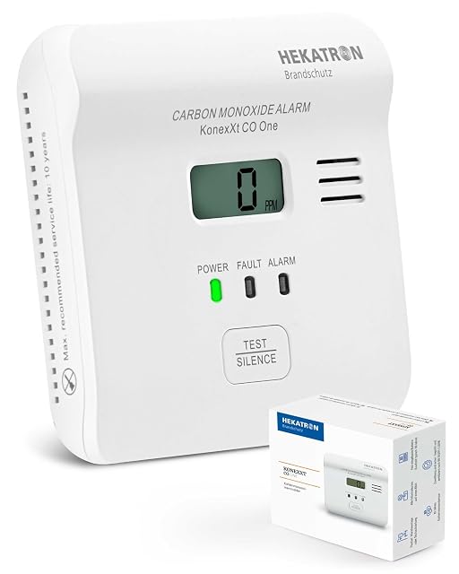 Détecteur de monoxyde de carbone Hekatron KonexXt CO One blanc à écran, posé à plat contre un mur
